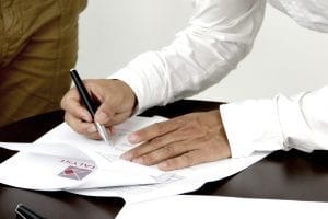 Man signing a document